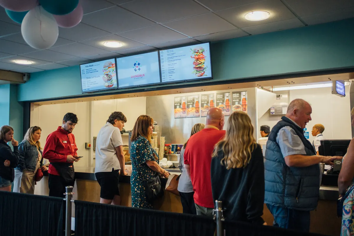 The fast food counter on a race night, people queueing.